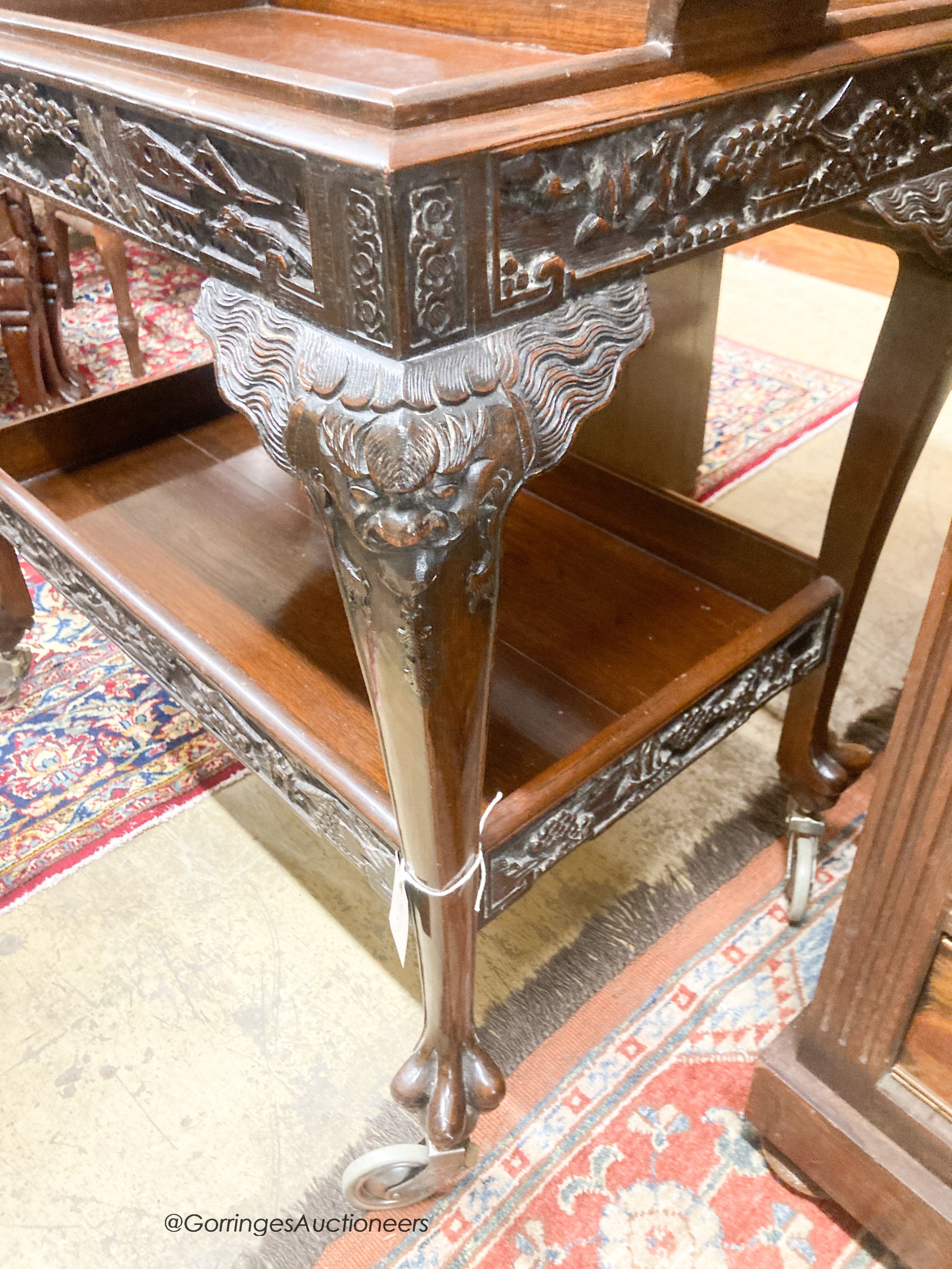 A Chinese carved hardwood tea trolley, with removable tray, width 80cm, depth 50cm, height 75cm